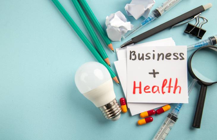 Front view business health with pills pencils injections blue background (1)